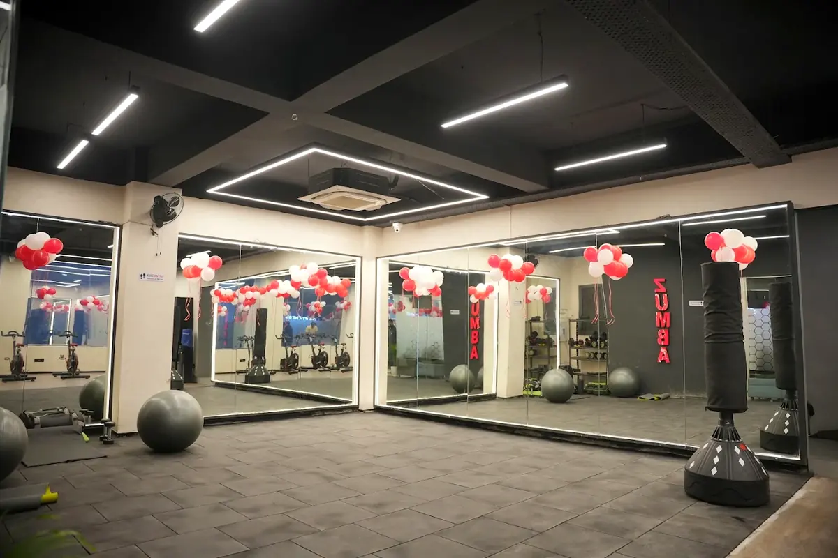 The group class studio with mirrored walls, punching bags and stability balls